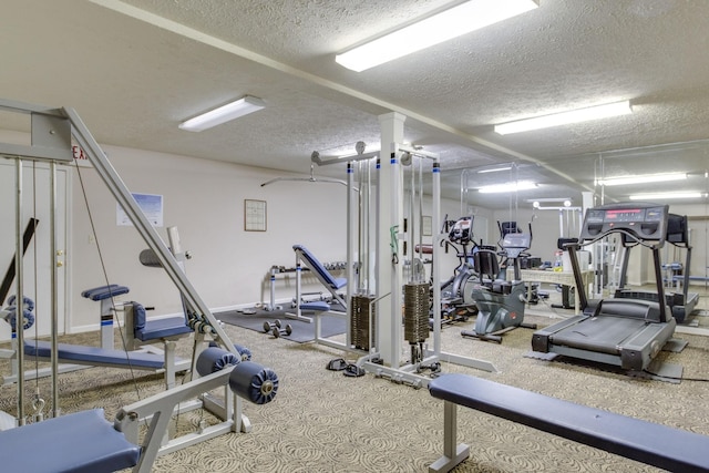 gym with a textured ceiling