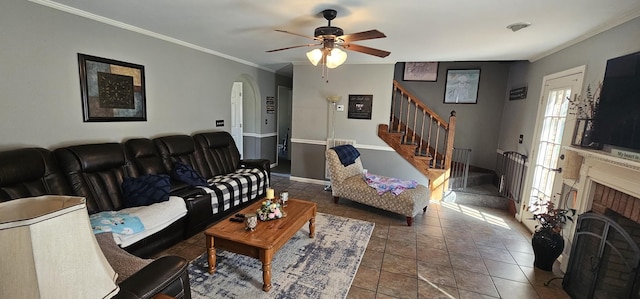 175 Travis Trl, Mcminnville, TN 37110 - living room with baseboards, ornamental molding, ceiling fan, a fireplace, and stairs