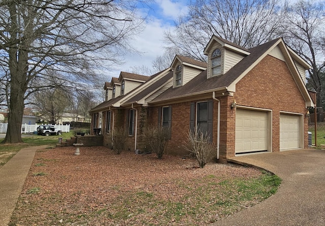 175 Travis Trl, Mcminnville, TN 37110 - view of property exterior with roof with shingles, driveway, and brick siding