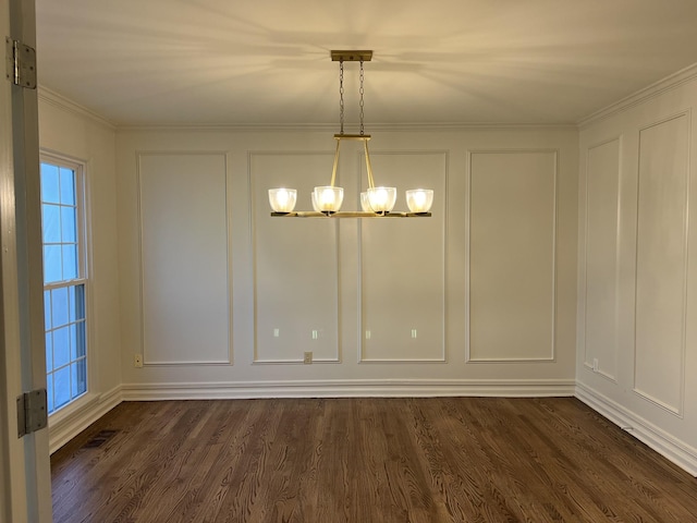 unfurnished dining area featuring a decorative wall, an inviting chandelier, and dark wood finished floors