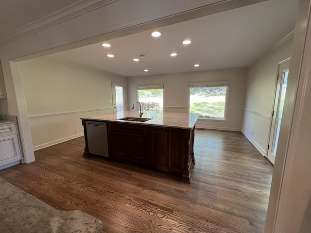 kitchen with dark wood-type flooring, ornamental molding, recessed lighting, dishwasher, and a sink