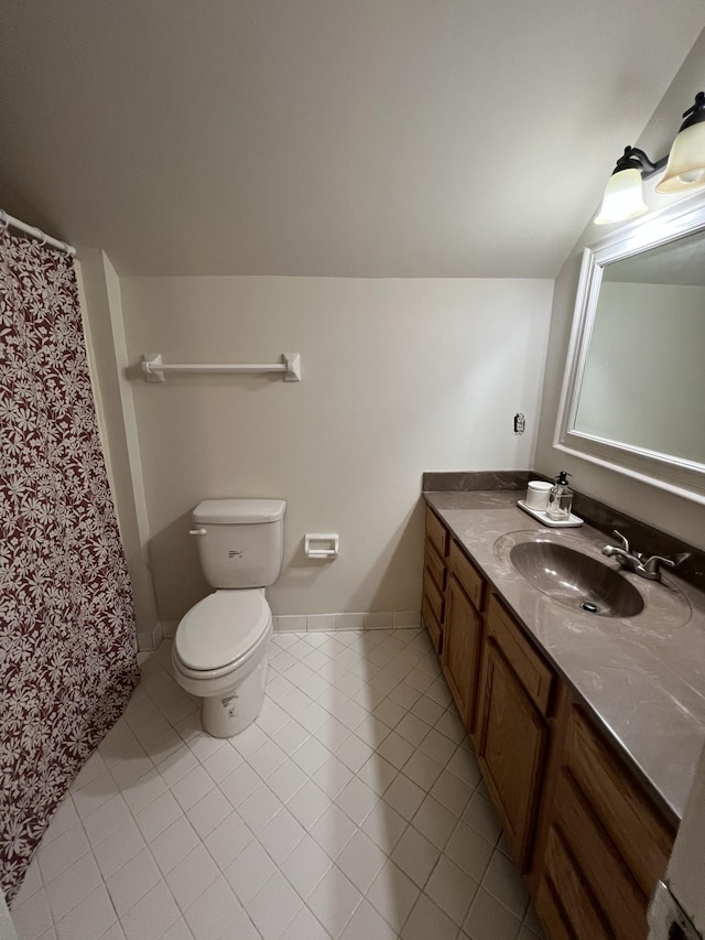 full bathroom featuring tile patterned floors, toilet, curtained shower, and vanity