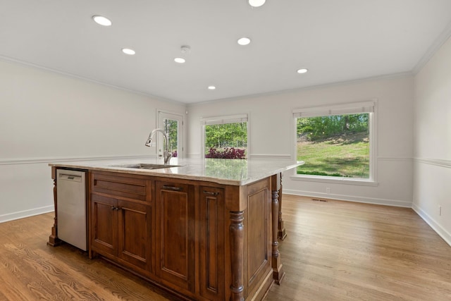 kitchen with stainless steel dishwasher, crown molding, a sink, light wood-style flooring, and recessed lighting