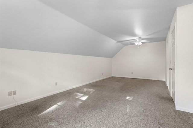 bonus room featuring baseboards, lofted ceiling, ceiling fan, and carpet