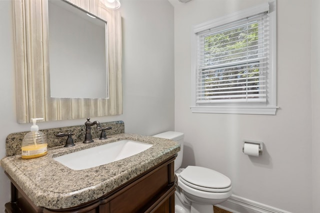half bath with toilet and vanity