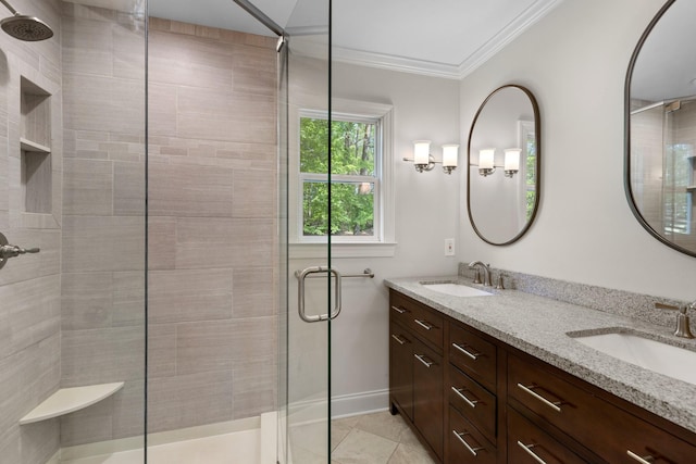 full bathroom with crown molding, tile patterned floors, a sink, and a stall shower