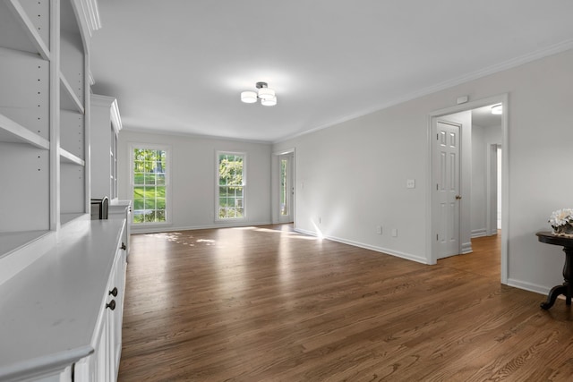 interior space featuring baseboards, dark wood-style floors, and crown molding