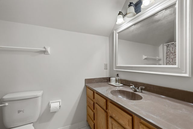 full bath featuring vanity and toilet