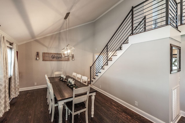 dining area featuring wood finished floors, baseboards, stairway, a notable chandelier, and crown molding