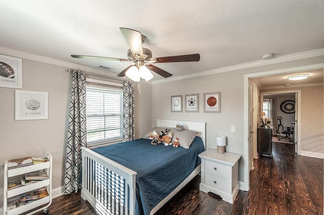 bedroom with ornamental molding, multiple windows, and baseboards
