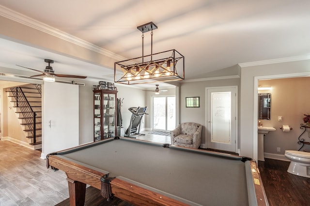 recreation room featuring wood finished floors, billiards, a ceiling fan, and ornamental molding