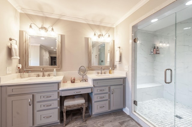 full bath with ornamental molding, a marble finish shower, double vanity, and a sink