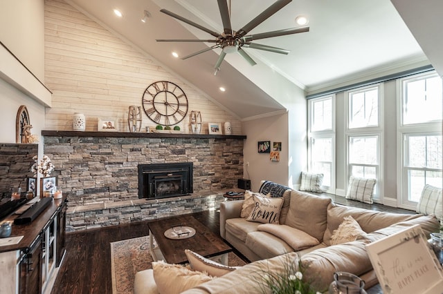living area with wood finished floors, ceiling fan, plenty of natural light, and high vaulted ceiling