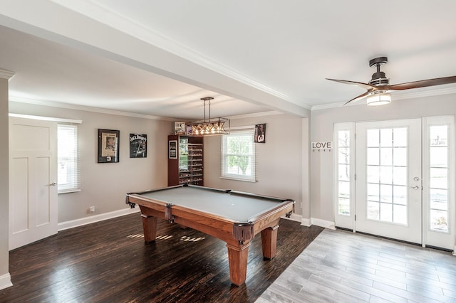 playroom featuring baseboards, wood finished floors, and ornamental molding