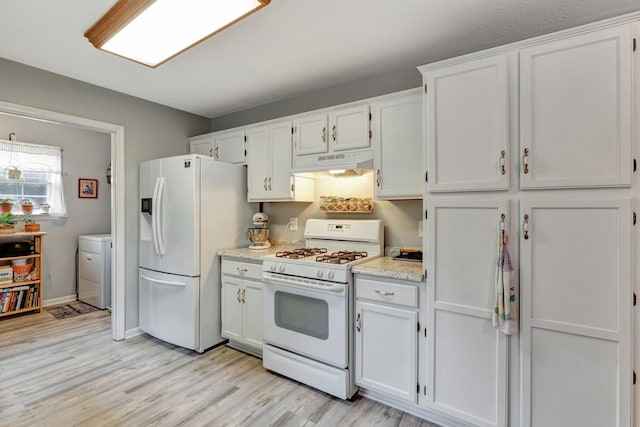 kitchen with white appliances, white cabinetry, under cabinet range hood, and light wood-type flooring