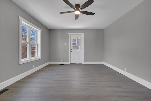 832 Richardson St, Clarksville, TN 37040 - unfurnished room with healthy amount of natural light, a ceiling fan, baseboards, and dark wood finished floors