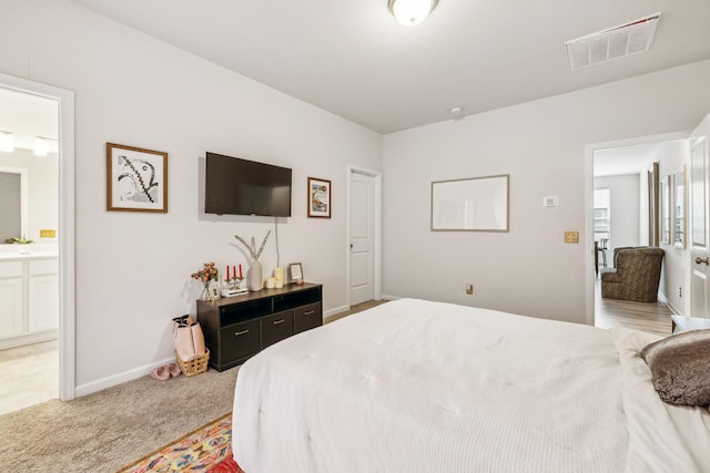 923 Long Train Aly, Antioch, TN 37013 - bedroom featuring baseboards, ensuite bathroom, visible vents, and light carpet