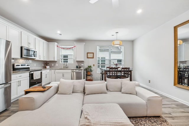 923 Long Train Aly, Antioch, TN 37013 - living area featuring recessed lighting, baseboards, light wood finished floors, and ceiling fan