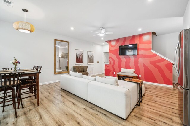 923 Long Train Aly, Antioch, TN 37013 - living area featuring light wood finished floors, baseboards, visible vents, and a ceiling fan