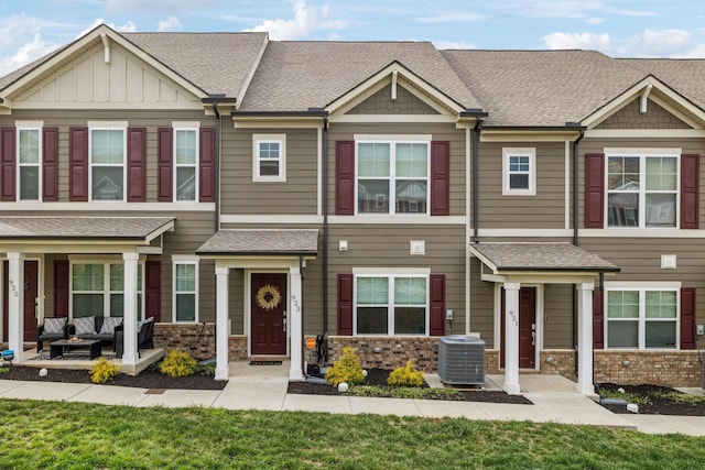 923 Long Train Aly, Antioch, TN 37013 - townhome / multi-family property with central air condition unit, an outdoor hangout area, stone siding, and roof with shingles