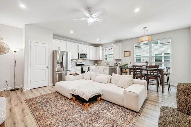 923 Long Train Aly, Antioch, TN 37013 - living area featuring baseboards, recessed lighting, a ceiling fan, and light wood finished floors