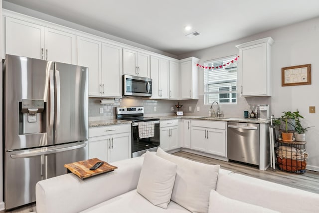 923 Long Train Aly, Antioch, TN 37013 - kitchen featuring white cabinetry, a sink, and stainless steel appliances