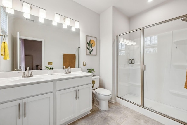 923 Long Train Aly, Antioch, TN 37013 - bathroom featuring a stall shower, double vanity, toilet, and a sink