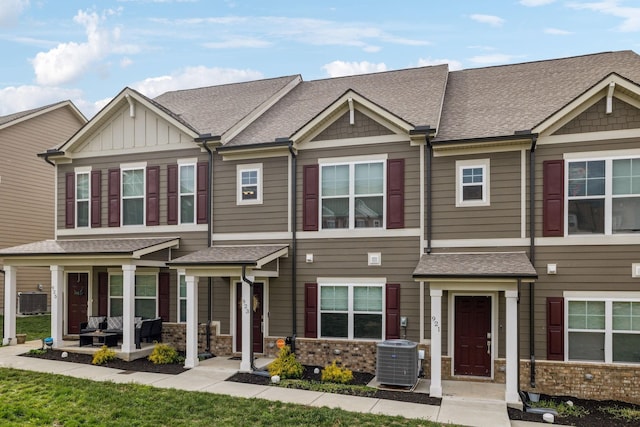 923 Long Train Aly, Antioch, TN 37013 - townhome / multi-family property featuring central air condition unit, stone siding, board and batten siding, and roof with shingles