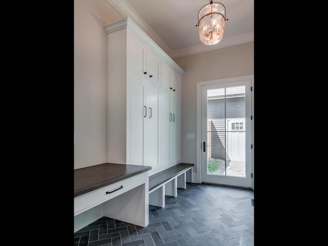 mudroom with a notable chandelier and crown molding