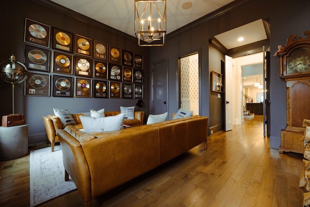 dining space with a notable chandelier, crown molding, stairway, wood-type flooring, and baseboards
