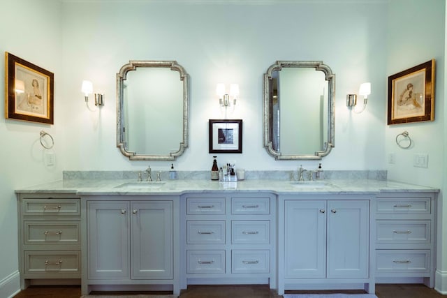 bathroom with double vanity and a sink