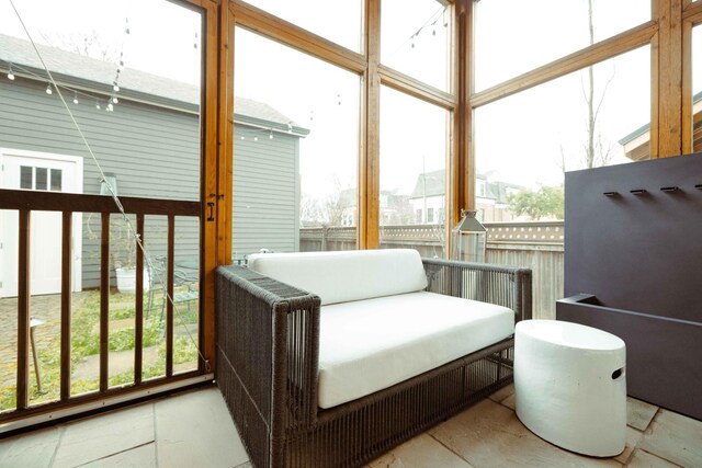 sunroom / solarium featuring a healthy amount of sunlight