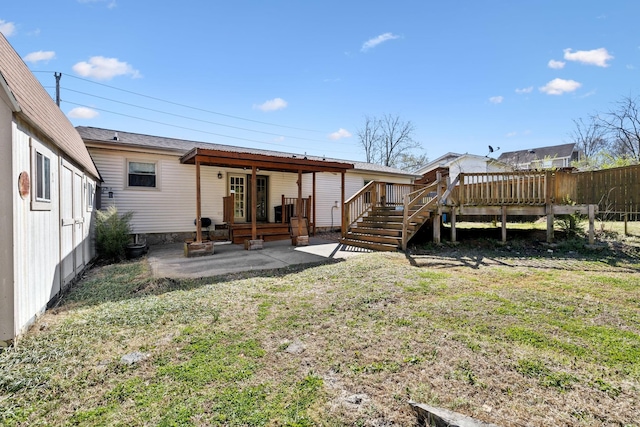 3049 Fieldstone Dr, Antioch, TN 37013 - back of property with a yard, a deck, and a patio area