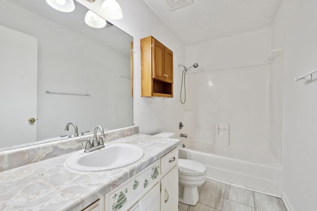 3049 Fieldstone Dr, Antioch, TN 37013 - bathroom with toilet, vanity, shower / bathtub combination, a textured ceiling, and visible vents