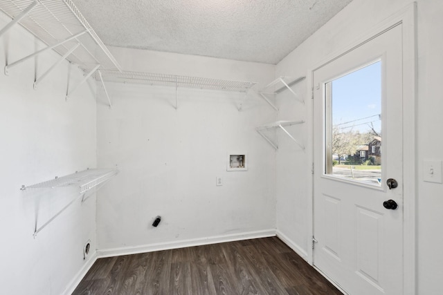 3049 Fieldstone Dr, Antioch, TN 37013 - laundry area featuring a textured ceiling, dark wood finished floors, laundry area, baseboards, and hookup for a washing machine