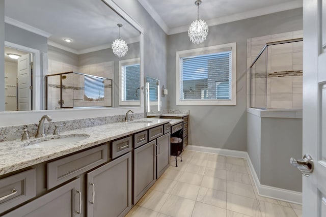 454 River Bluff Dr, Franklin, TN 37064 - bathroom featuring a stall shower, a notable chandelier, crown molding, and a sink