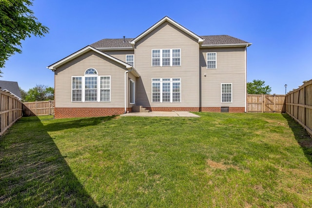 back of property with a lawn, a fenced backyard, and a patio area