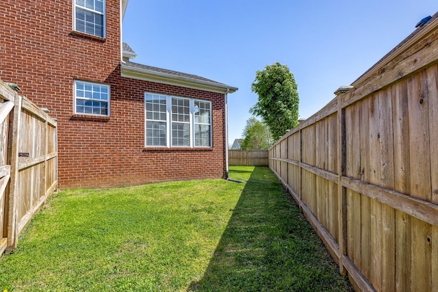 view of yard with a fenced backyard