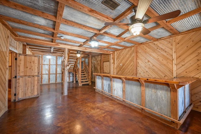 576 Ridgeway Dr, Sugar Tree, TN 38380 - interior space featuring visible vents, wooden walls, a ceiling fan, finished concrete floors, and coffered ceiling