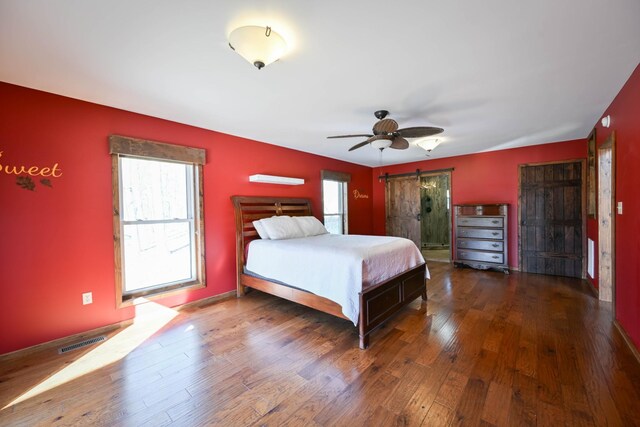 576 Ridgeway Dr, Sugar Tree, TN 38380 - bedroom featuring visible vents, multiple windows, ceiling fan, and wood finished floors