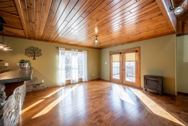 576 Ridgeway Dr, Sugar Tree, TN 38380 - living room featuring wooden ceiling, french doors, wood finished floors, a wood stove, and baseboards