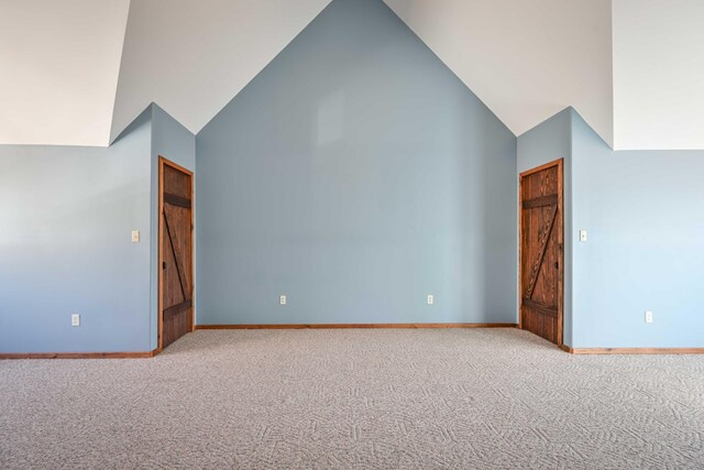 576 Ridgeway Dr, Sugar Tree, TN 38380 - bonus room featuring carpet flooring, high vaulted ceiling, and baseboards
