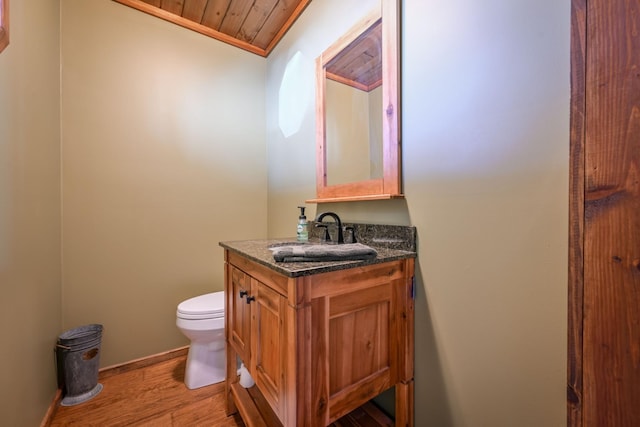 576 Ridgeway Dr, Sugar Tree, TN 38380 - half bath with baseboards, toilet, wood finished floors, vanity, and wooden ceiling