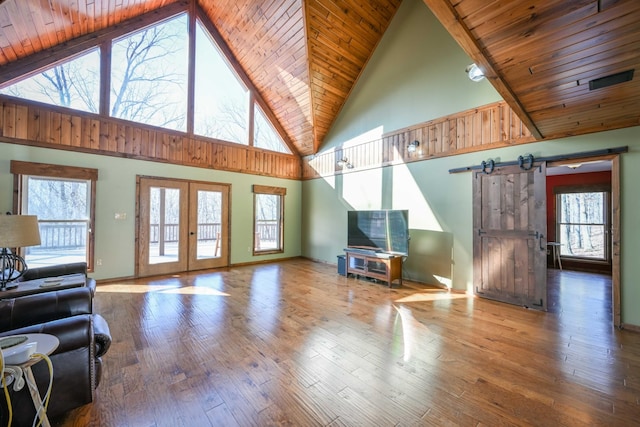 576 Ridgeway Dr, Sugar Tree, TN 38380 - living area with plenty of natural light, a barn door, and wood finished floors