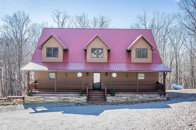 576 Ridgeway Dr, Sugar Tree, TN 38380 - view of front of home with faux log siding, covered porch, and metal roof