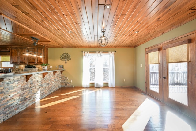 576 Ridgeway Dr, Sugar Tree, TN 38380 - living area featuring a notable chandelier, wooden ceiling, french doors, light wood-style flooring, and baseboards