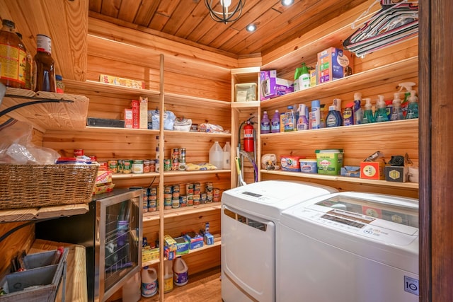 576 Ridgeway Dr, Sugar Tree, TN 38380 - washroom featuring washer and dryer, wooden ceiling, laundry area, and wood walls