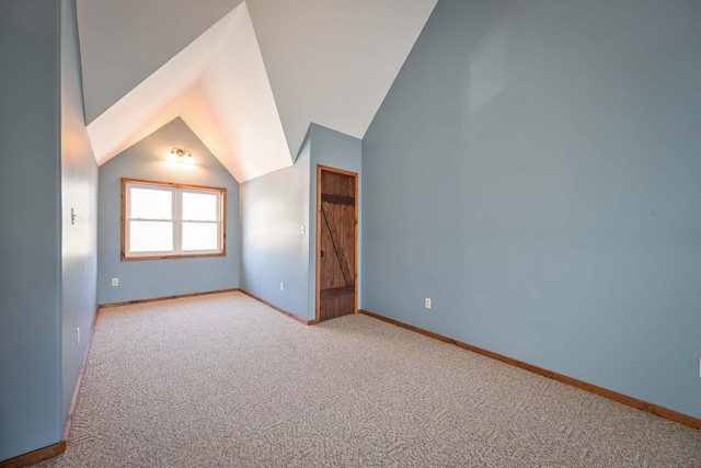576 Ridgeway Dr, Sugar Tree, TN 38380 - additional living space with baseboards, vaulted ceiling, and carpet flooring