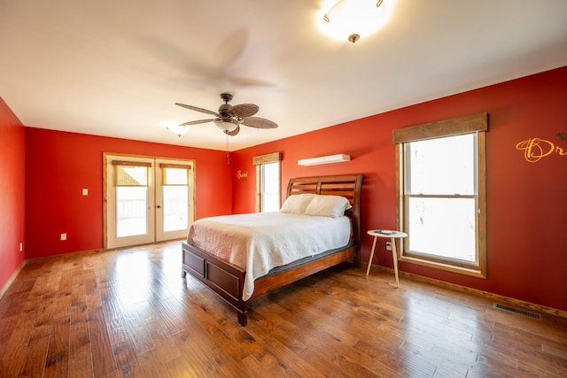 576 Ridgeway Dr, Sugar Tree, TN 38380 - bedroom featuring visible vents, baseboards, access to outside, wood finished floors, and french doors
