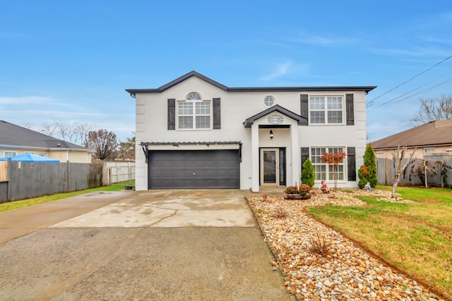 traditional-style house with concrete driveway, stucco siding, fence, a front lawn, and a garage